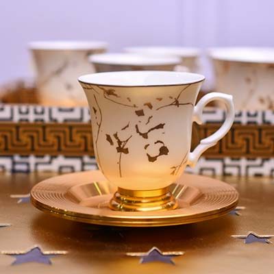 White Coffee Cup and Saucer Set | Features a gold line pattern | - photo 1